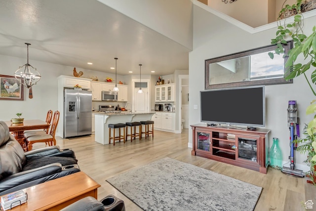 14397 S Hill Shadow Way Unit 87, Herriman, UT 84096 - living area featuring a chandelier, light wood finished floors, and recessed lighting