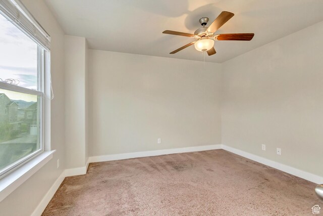 14397 S Hill Shadow Way Unit 87, Herriman, UT 84096 - empty room with carpet floors, healthy amount of natural light, a ceiling fan, and baseboards