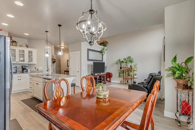 14397 S Hill Shadow Way Unit 87, Herriman, UT 84096 - dining area with light wood finished floors, recessed lighting, a chandelier, and baseboards