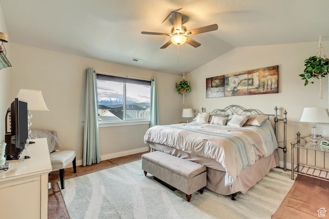 14397 S Hill Shadow Way Unit 87, Herriman, UT 84096 - bedroom featuring light colored carpet, vaulted ceiling, baseboards, and ceiling fan