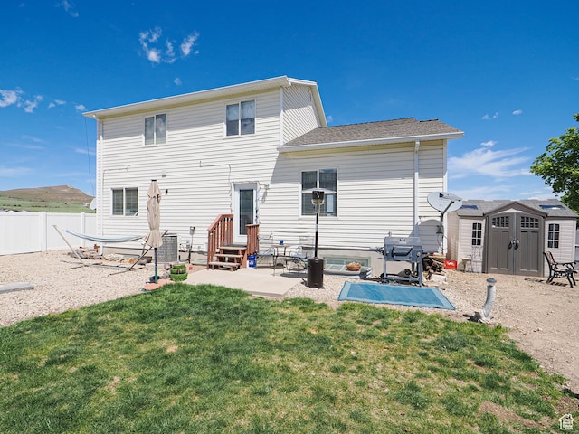 back of property featuring a storage shed, a patio, entry steps, an outbuilding, and central AC unit