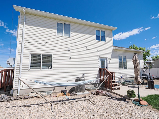 back of house with a patio, central AC, and entry steps