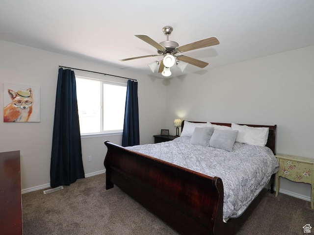 carpeted bedroom featuring ceiling fan and baseboards