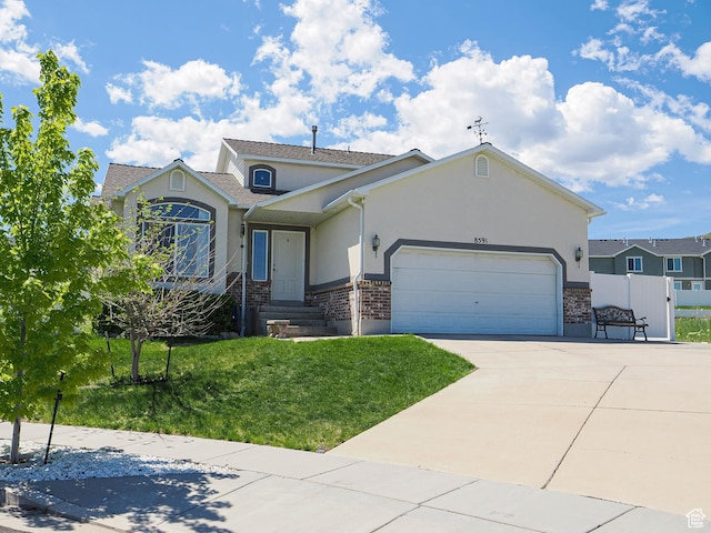 view of front of home featuring stucco siding, a garage, and concrete driveway