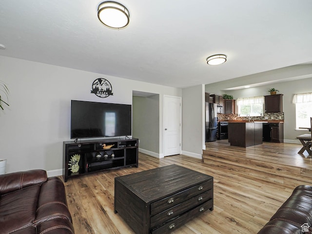 living area featuring wood finished floors and baseboards