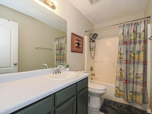 bathroom featuring tile patterned flooring, vanity, shower / bath combination with curtain, and toilet