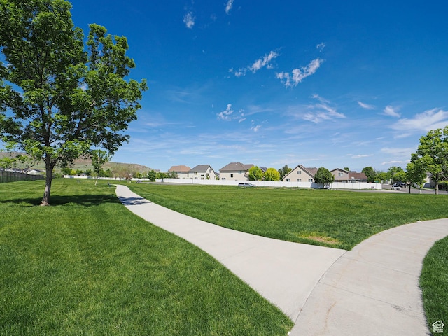 surrounding community featuring a yard