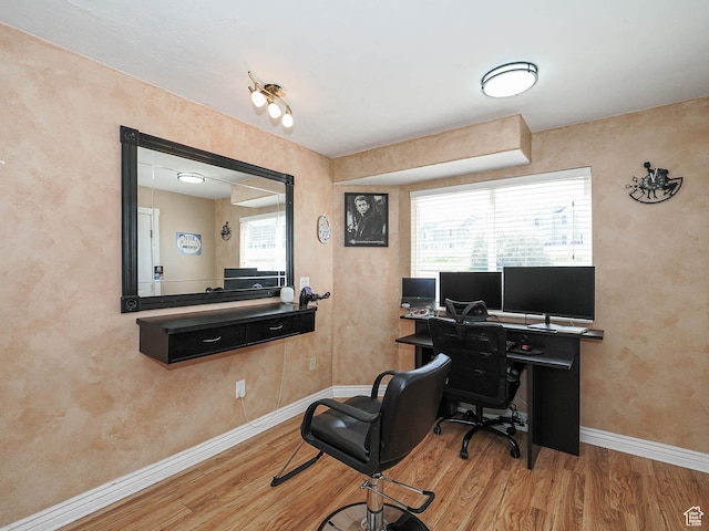 office space featuring wood finished floors and baseboards