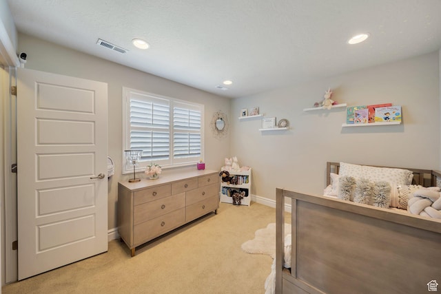 bedroom with light carpet, baseboards, and recessed lighting