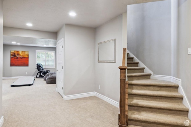staircase featuring carpet, recessed lighting, and baseboards