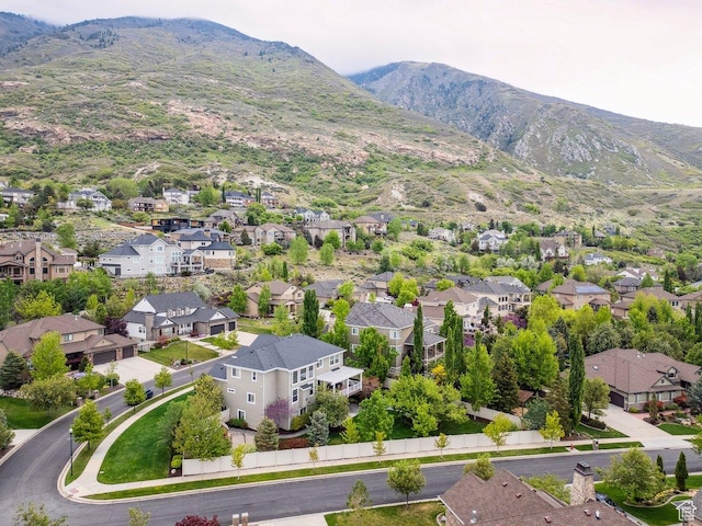 aerial perspective of suburban area with a mountainous background