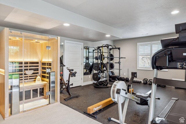 workout room with recessed lighting and baseboards