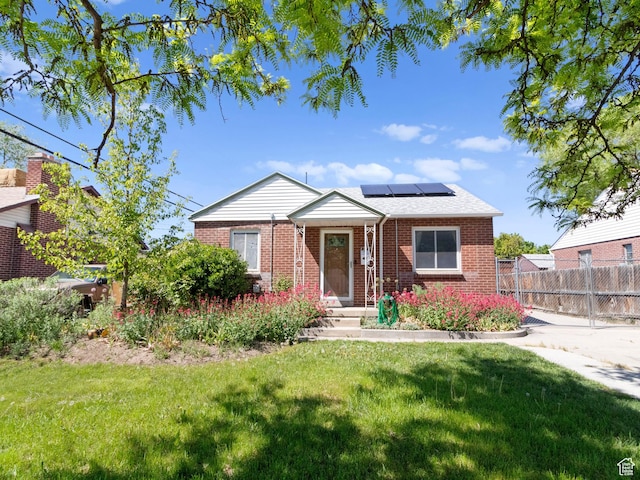 1212 W Talisman, Salt Lake City, UT 84116 - view of front of home with brick siding and roof mounted solar panels