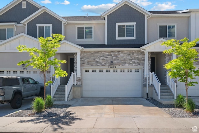 2005 N 4260 W, Lehi, UT 84043 - view of front of property featuring stone siding, concrete driveway, and a garage