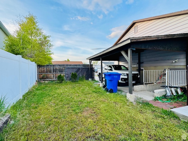 view of yard with a carport
