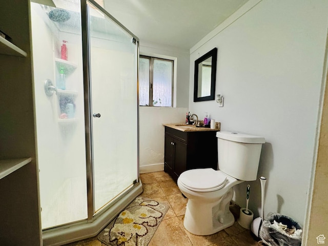 bathroom with vanity, a shower stall, toilet, and tile patterned flooring
