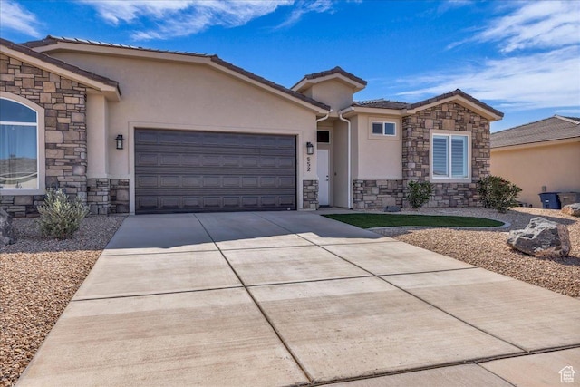 view of front of home featuring stone siding, stucco siding, an attached garage, driveway, and a tile roof