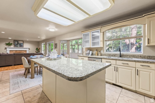 8017 S Showcase Ln, Sandy, UT 84094 - kitchen featuring a sink, a center island, open floor plan, light tile patterned flooring, and recessed lighting