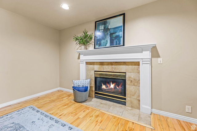 8017 S Showcase Ln, Sandy, UT 84094 - detailed view of wood finished floors, baseboards, a fireplace, and recessed lighting