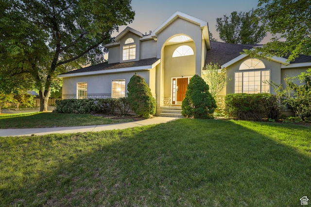 8017 S Showcase Ln, Sandy, UT 84094 - traditional home with stucco siding, a front yard, and roof with shingles