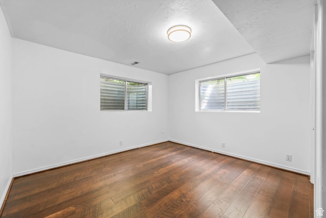 8017 S Showcase Ln, Sandy, UT 84094 - unfurnished room with hardwood / wood-style floors, baseboards, and a textured ceiling