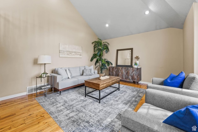 8017 S Showcase Ln, Sandy, UT 84094 - living area featuring vaulted ceiling, baseboards, wood finished floors, and recessed lighting