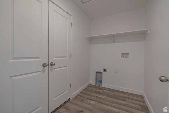 washroom featuring washer hookup, hookup for an electric dryer, light wood-type flooring, and baseboards