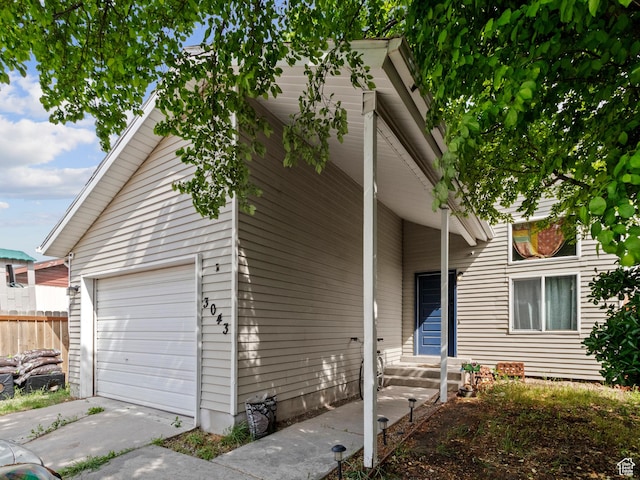 view of front of home with fence and entry steps