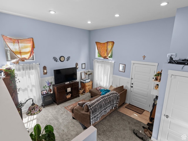 living room with recessed lighting and carpet flooring