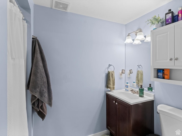 full bathroom with vanity and toilet