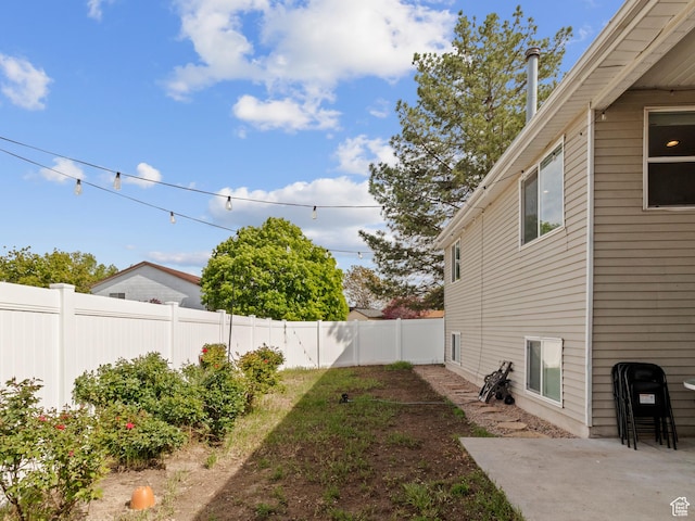 fenced backyard with a patio