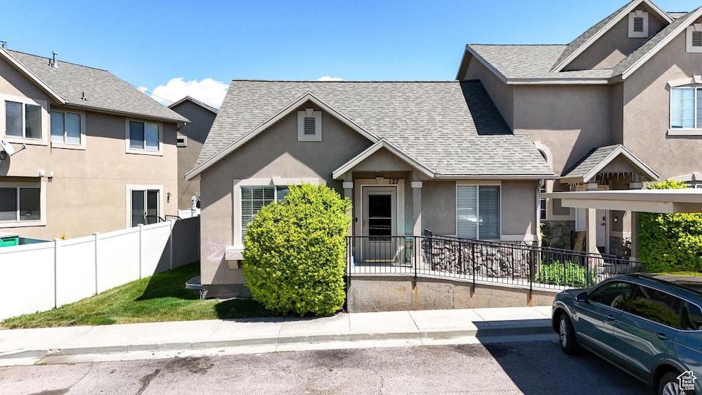 1166 N 220 W # 127, Tooele, UT 84074 - multi unit property with stucco siding, a shingled roof, and fence