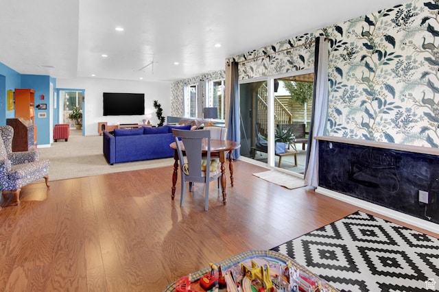 dining area with wood finished floors and recessed lighting