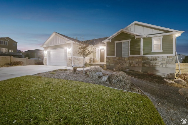 view of front of property featuring stone siding, board and batten siding, concrete driveway, and a garage