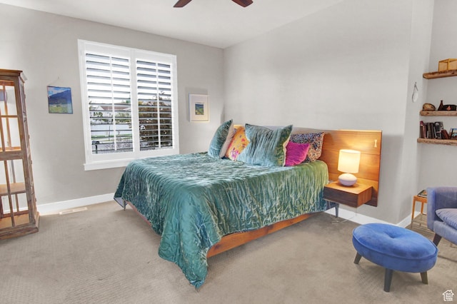 carpeted bedroom with baseboards and ceiling fan