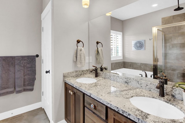 bathroom featuring a shower stall, tile patterned flooring, double vanity, and a bath