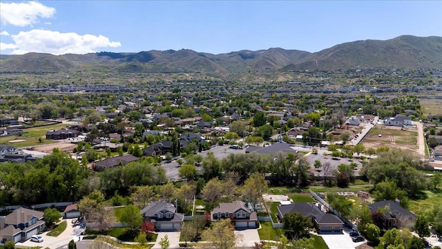 aerial view of residential area featuring mountains