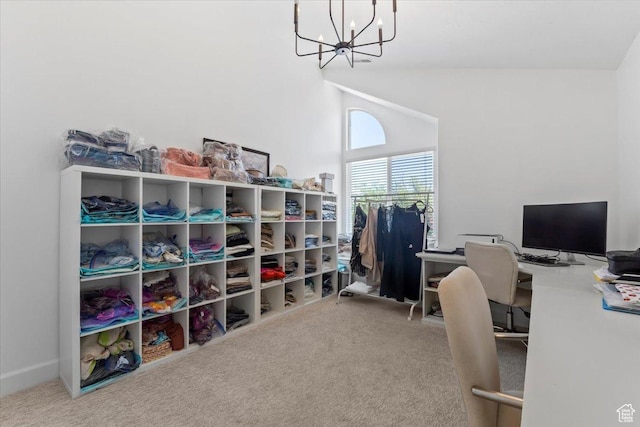 carpeted office with a chandelier and lofted ceiling