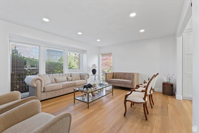 living area featuring light wood-type flooring and recessed lighting