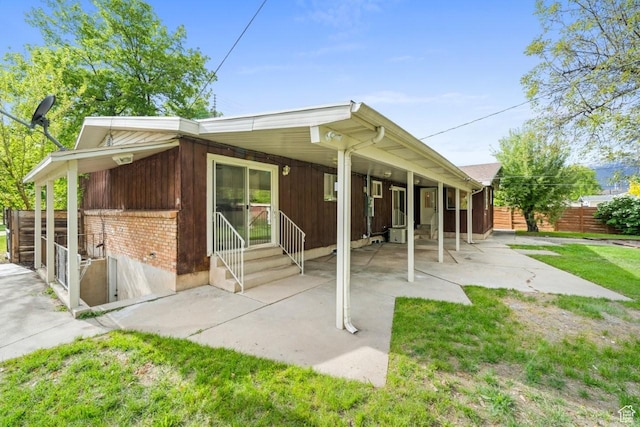 1731 S 145 E, Orem, UT 84058 - view of front of property with brick siding, fence, entry steps, and a patio