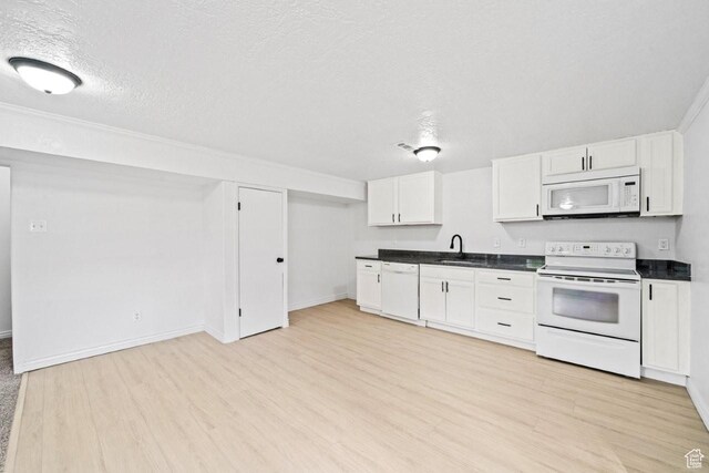 1731 S 145 E, Orem, UT 84058 - kitchen featuring white appliances, light wood-type flooring, dark countertops, white cabinets, and a textured ceiling