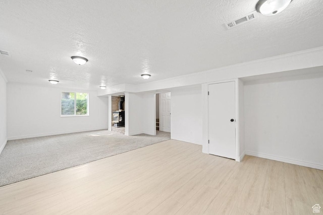 1731 S 145 E, Orem, UT 84058 - below grade area with a textured ceiling, light wood-type flooring, and baseboards