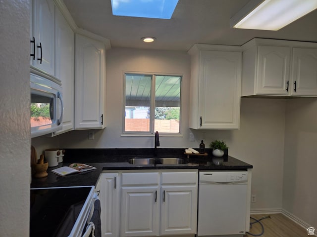 1731 S 145 E, Orem, UT 84058 - kitchen featuring white appliances, a sink, white cabinets, healthy amount of natural light, and recessed lighting
