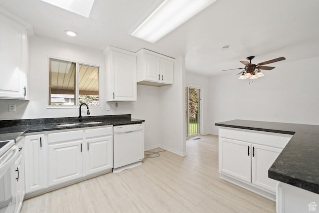 1731 S 145 E, Orem, UT 84058 - kitchen with a sink, white dishwasher, a skylight, white cabinets, and stove