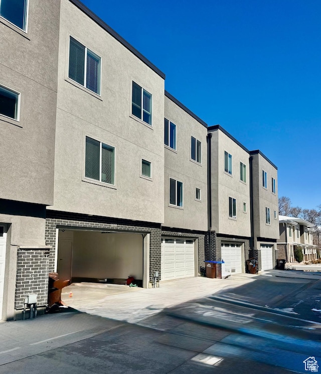 view of building exterior with an attached garage