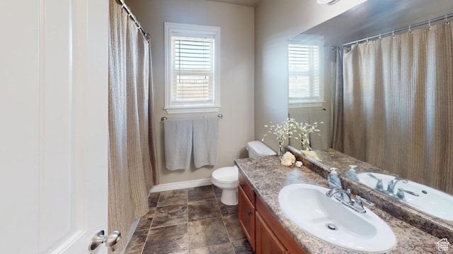 90 W Cedar Ln, Franklin, ID 83237 - full bathroom featuring vanity, toilet, and baseboards