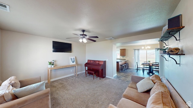 90 W Cedar Ln, Franklin, ID 83237 - carpeted living area with a chandelier, ceiling fan, and baseboards