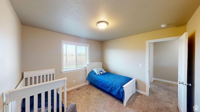 90 W Cedar Ln, Franklin, ID 83237 - carpeted bedroom featuring baseboards and a textured ceiling