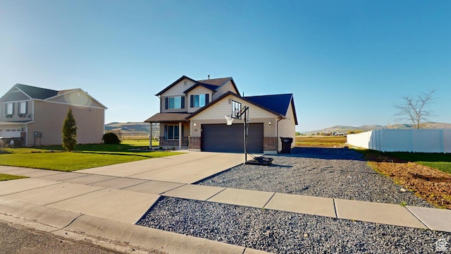 90 W Cedar Ln, Franklin, ID 83237 - craftsman-style house featuring driveway, brick siding, and an attached garage