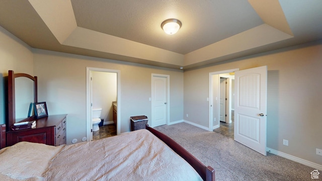 90 W Cedar Ln, Franklin, ID 83237 - bedroom with a tray ceiling, carpet floors, baseboards, and ensuite bath